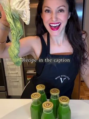 Cheryl with celery and bottles of green juice in her original cooking video